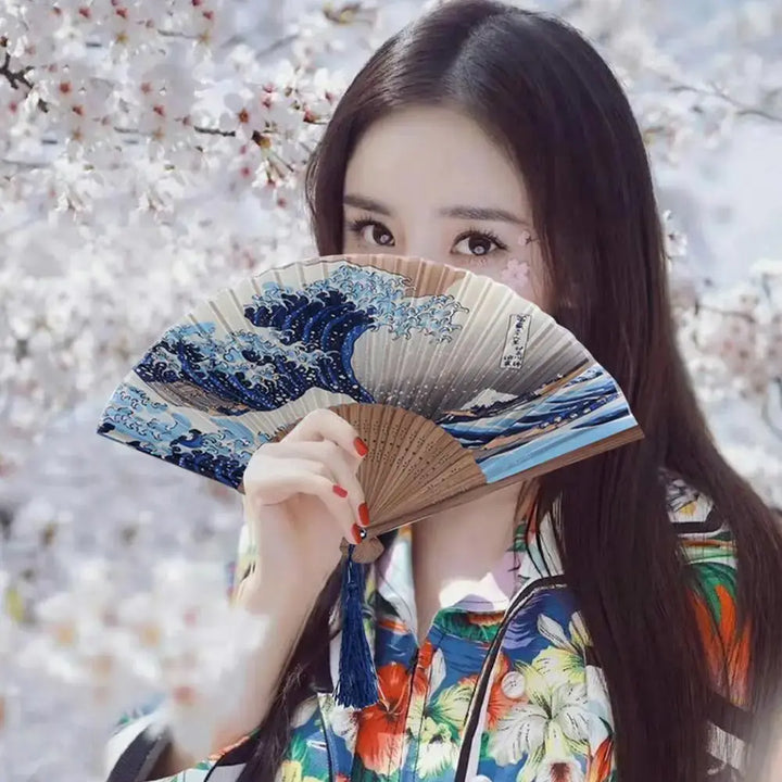 woman holding a hand fan japanese