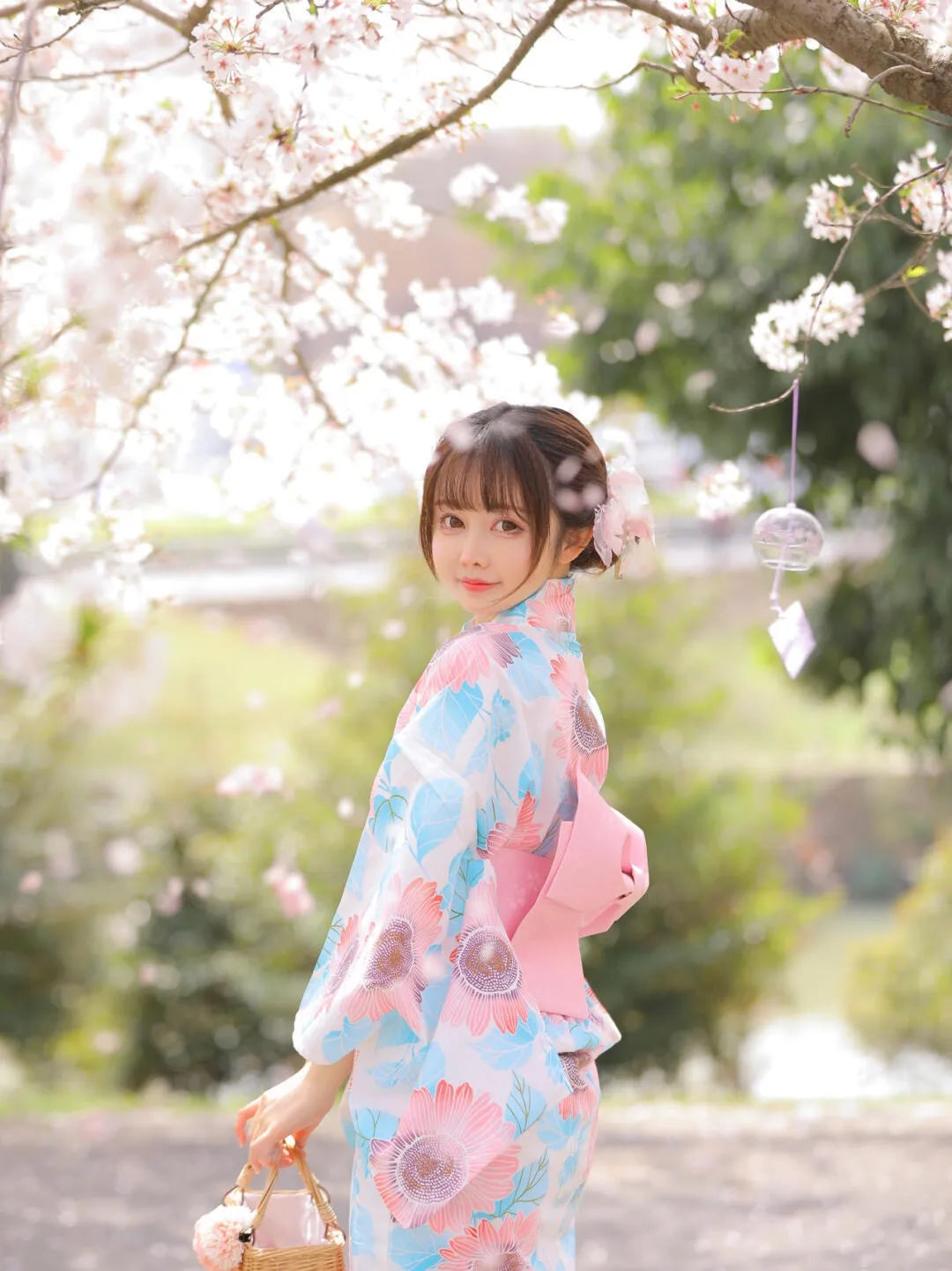 happy woman with pink and blue kimono