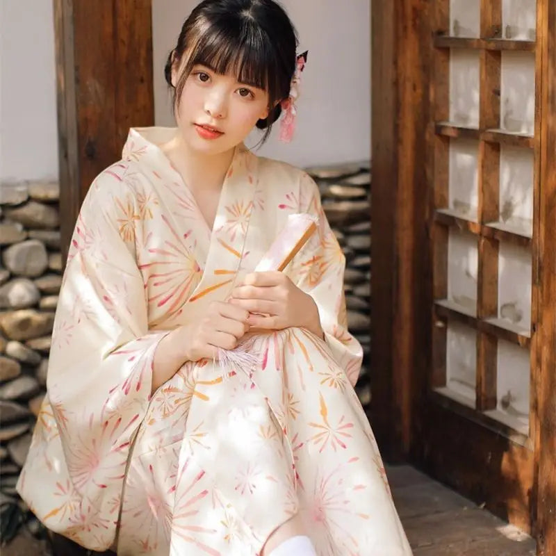 sitted woman with yellow silk kimono robe