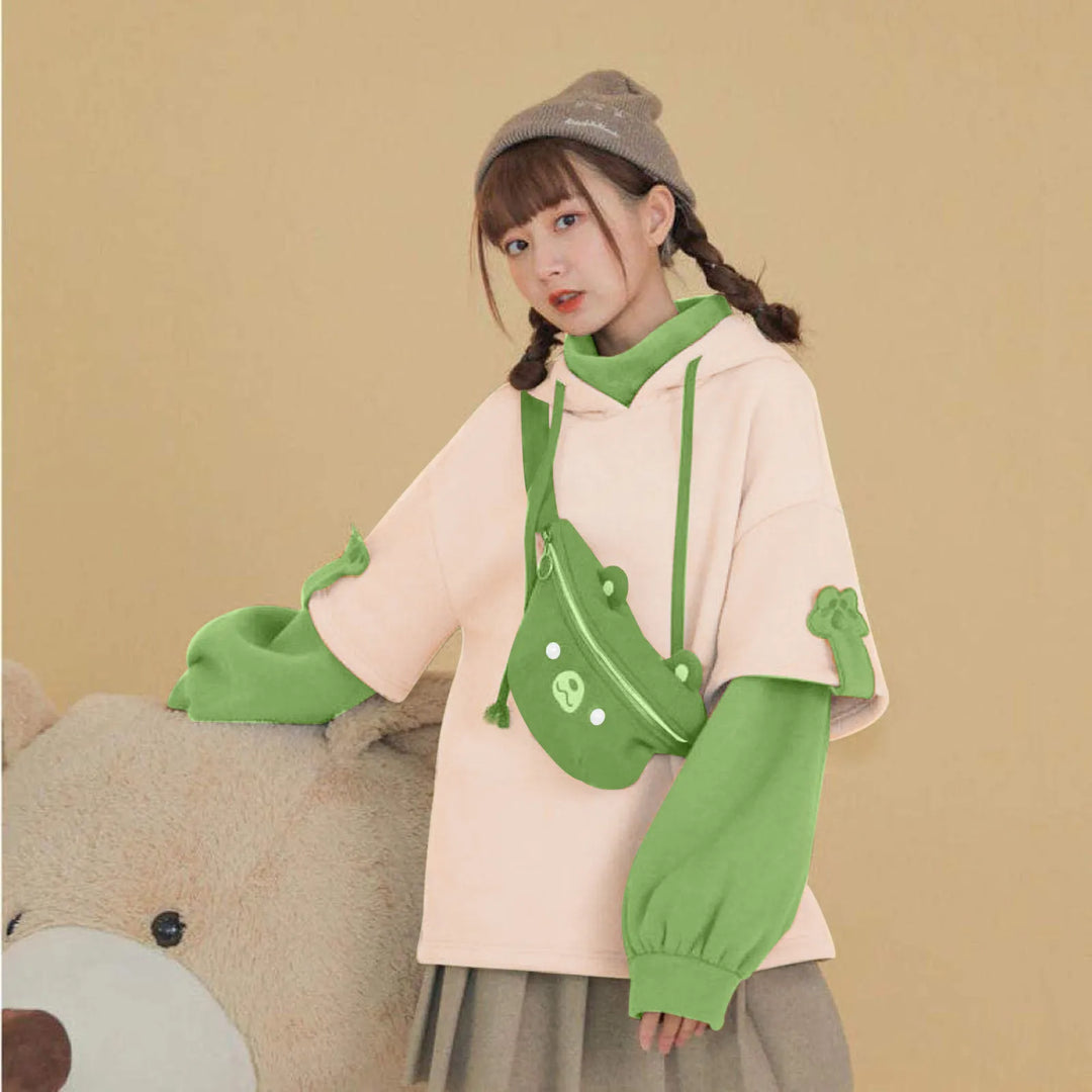 woman wearing green kawaii bear hoodie