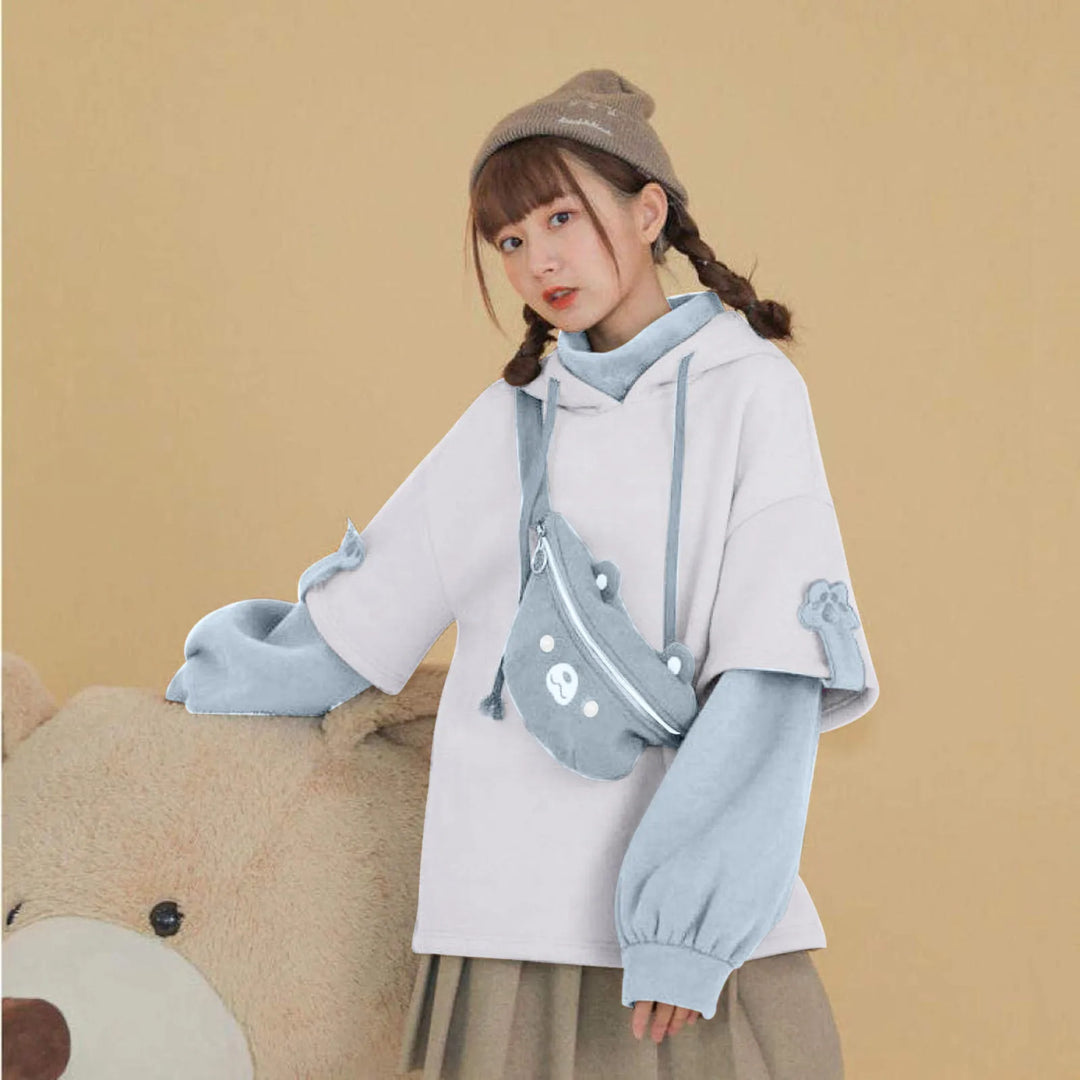 woman wearing blue kawaii bear hoodie