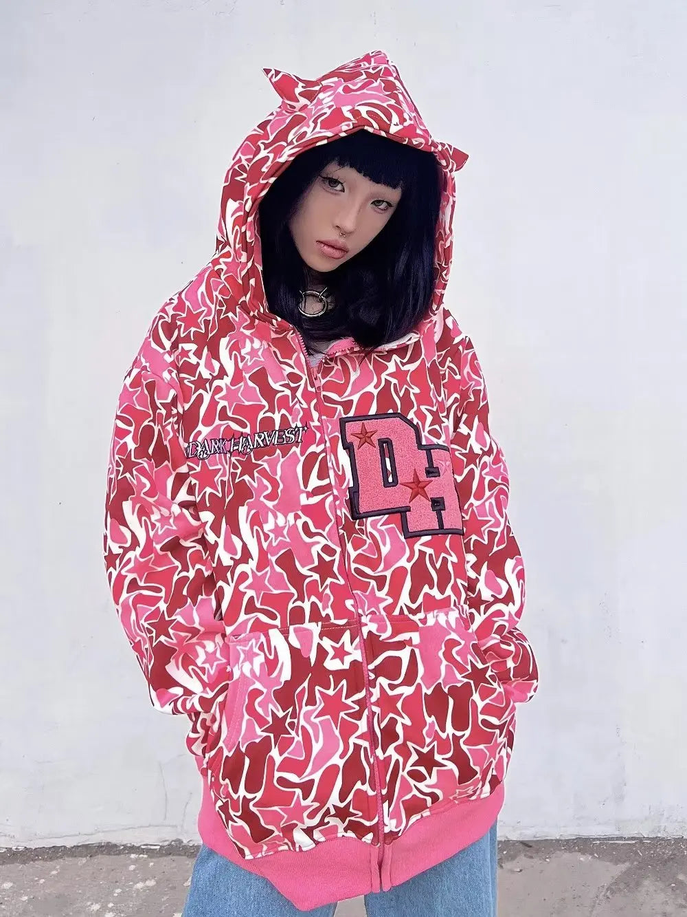 woman wearing dark harvest hoodie pink