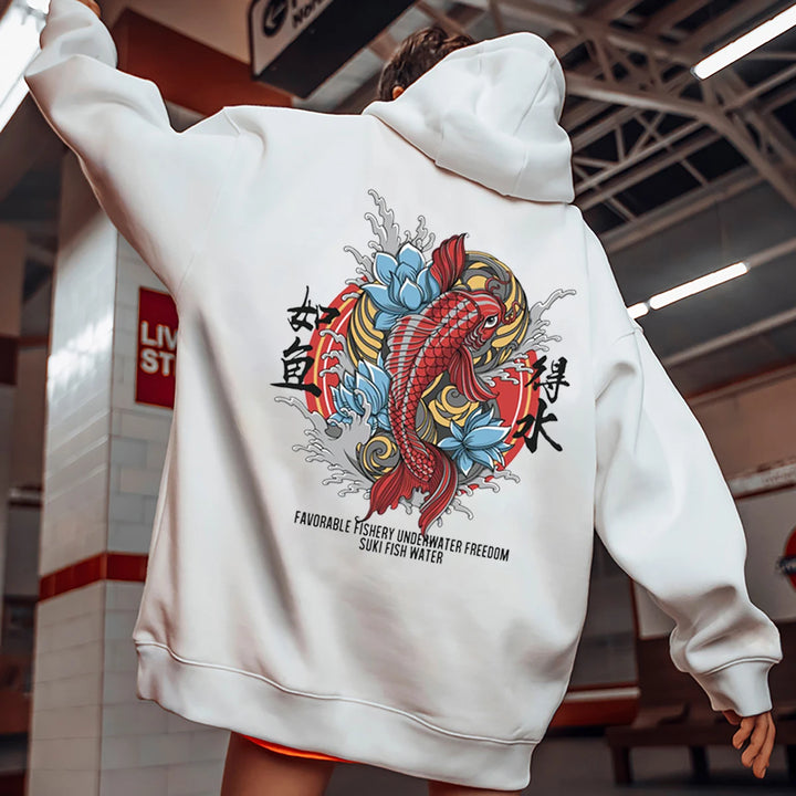 woman in metro station wearing white koi fish hoodie