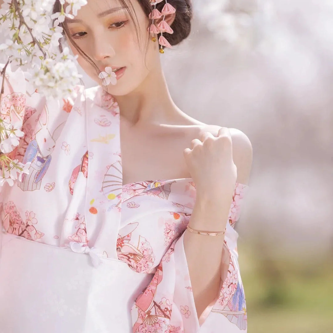 happy girl wearing a pink and white kimono