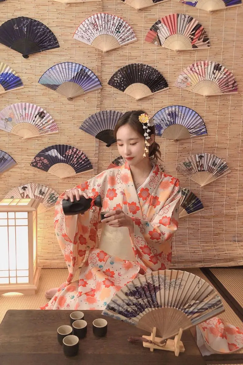 happy japanese woman wearing a floral kimono dress