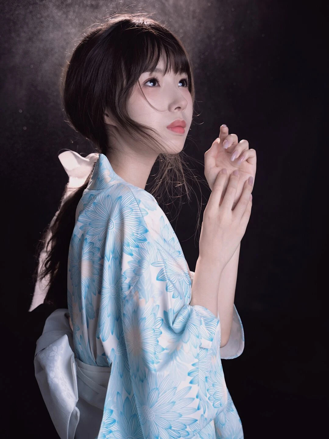 thinking woman with a blue floral kimono robe