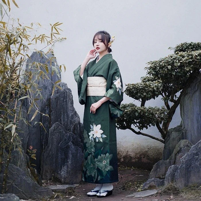 woman wearing green kimono dress